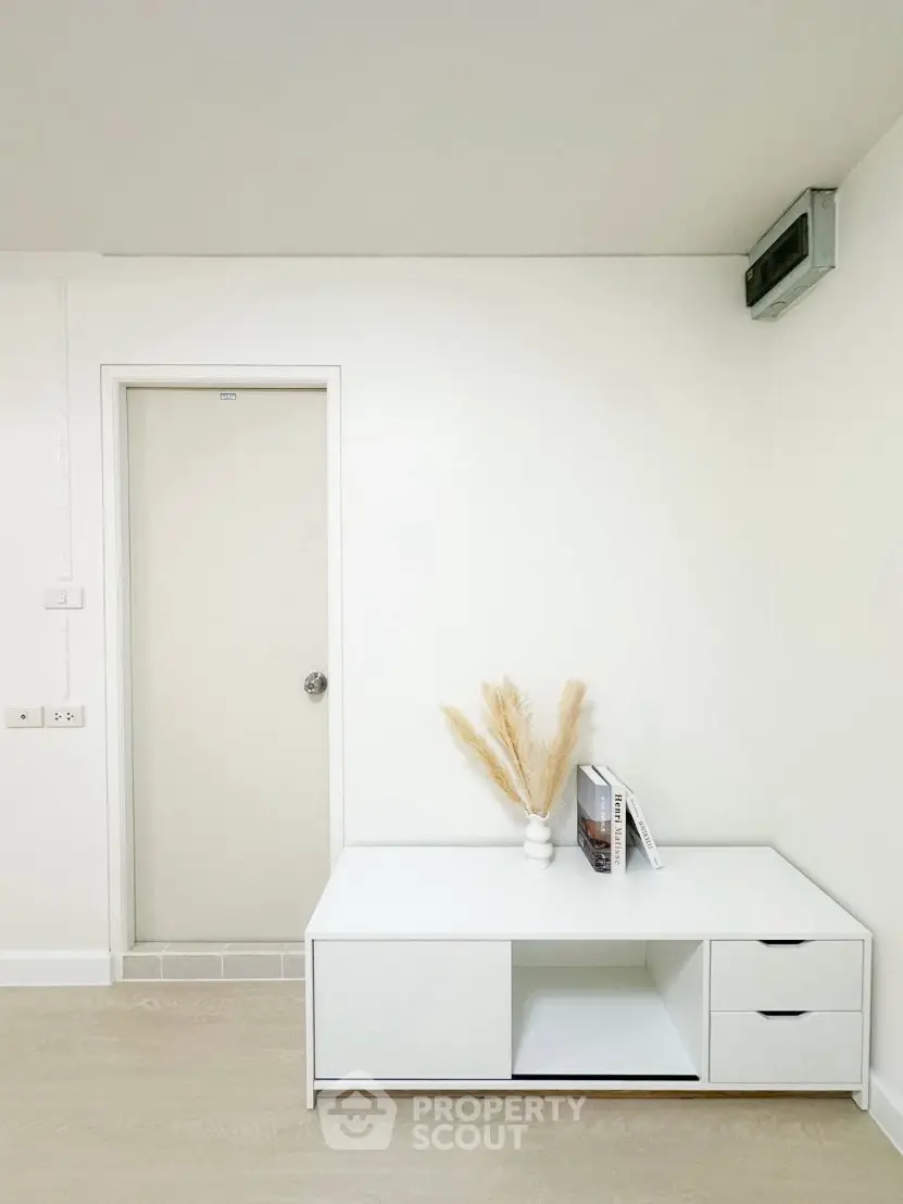 Minimalist white interior with modern furniture and decor