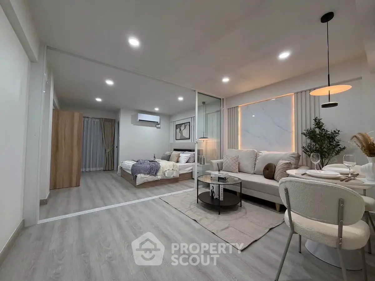 Modern open-plan living room with stylish decor and cozy ambiance