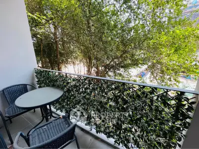Charming balcony with lush greenery and cozy seating, perfect for relaxation and enjoying nature.