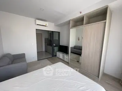 Modern studio apartment with sleek design and built-in wardrobe