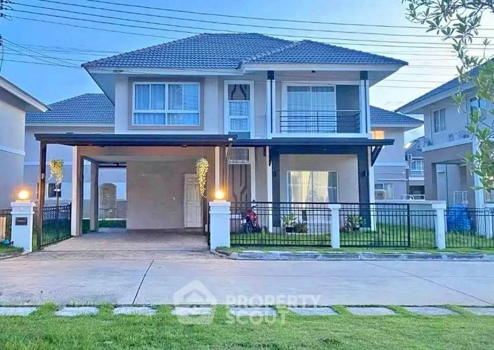 Modern two-story house with spacious driveway and well-maintained lawn