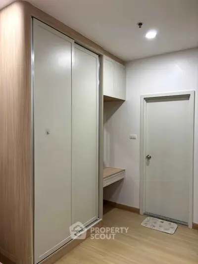Modern minimalist bedroom with built-in wardrobe and sleek design