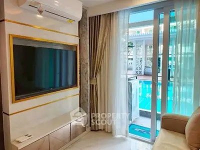 Luxurious living room with pool view and modern TV setup