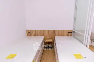 Modern bedroom with twin beds and minimalist design