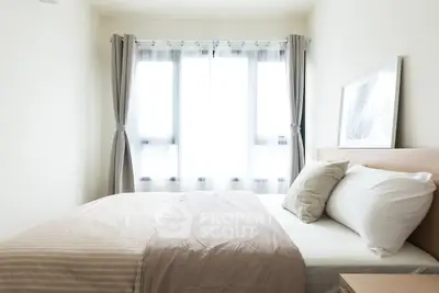 Bright and cozy bedroom with large windows and elegant decor