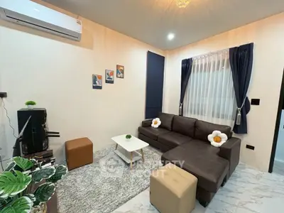 Cozy living room with modern decor and comfortable seating