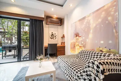 Chic living room with stylish decor and garden view, perfect for modern urban living.