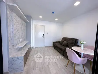 Modern living room with marble accents and cozy seating area