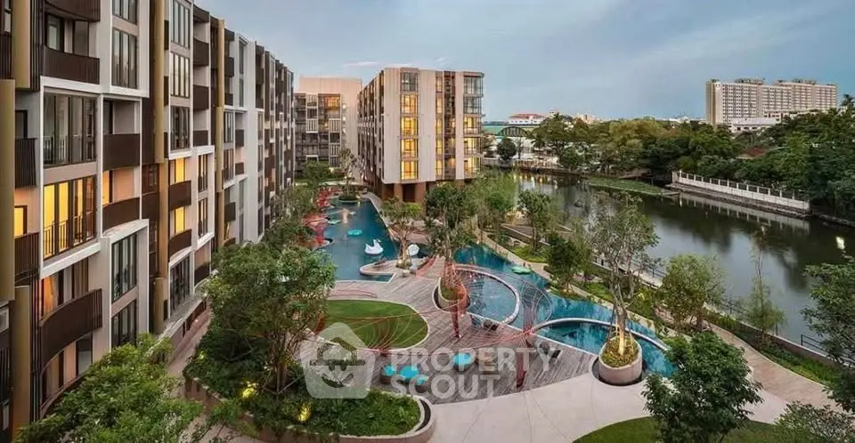 Luxurious modern apartment complex with pool and garden view