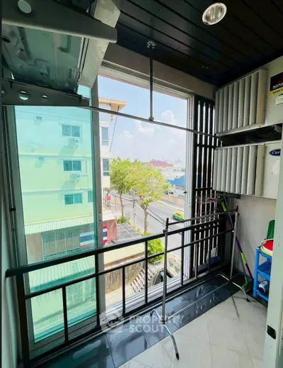 Charming balcony with urban view, perfect for relaxation and enjoying city life.