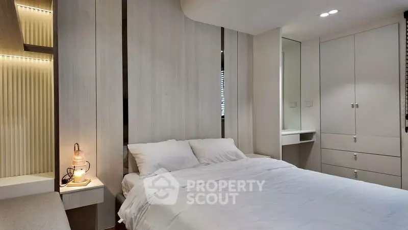 Modern bedroom with sleek design and ambient lighting