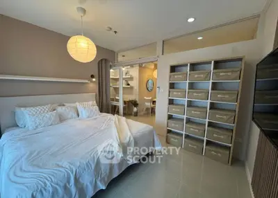 Spacious bedroom with modern storage solutions and cozy lighting