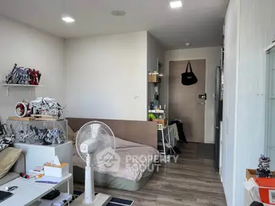 Cozy bedroom with modern decor and ample natural light