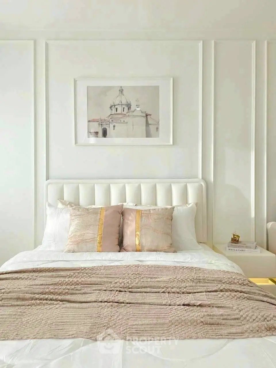 Elegant bedroom with plush bedding and stylish decor in a modern apartment.
