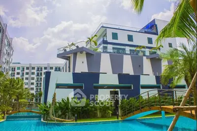Modern building with pool and lush greenery, perfect for luxurious living.