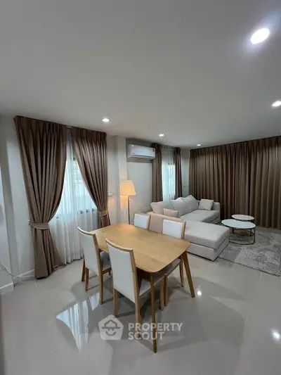Spacious modern living room with elegant decor and natural light