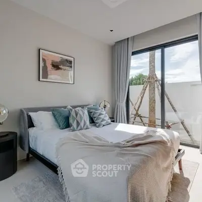 Bright and modern bedroom with large window and stylish decor