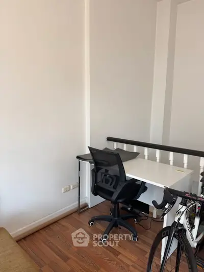 Modern study nook with sleek desk and ergonomic chair, perfect for productivity.