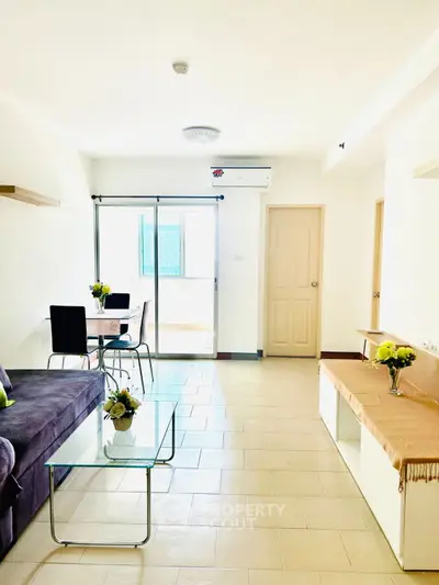Bright and airy living room with modern furniture and glass coffee table