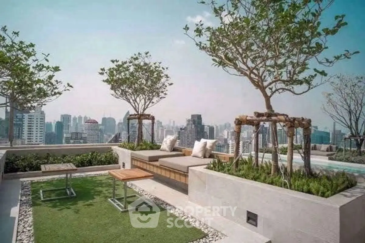 Luxurious rooftop garden with city skyline view and modern seating area.
