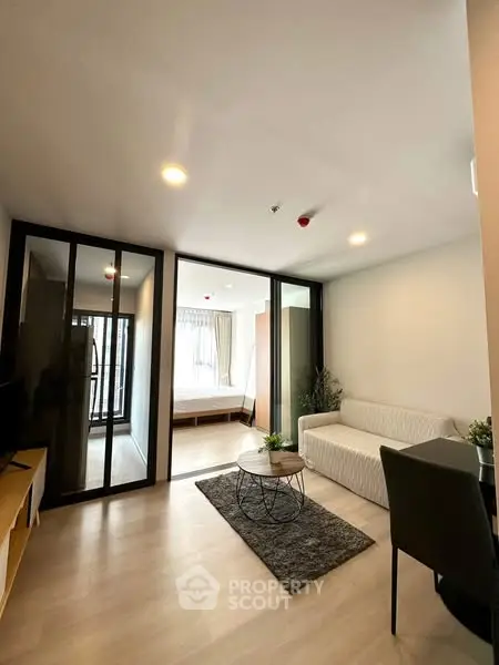 Modern living room with sleek design and cozy furniture in a stylish apartment.