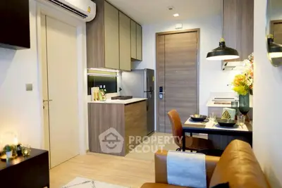Modern compact kitchen with stylish dining area and cozy seating in a chic apartment.