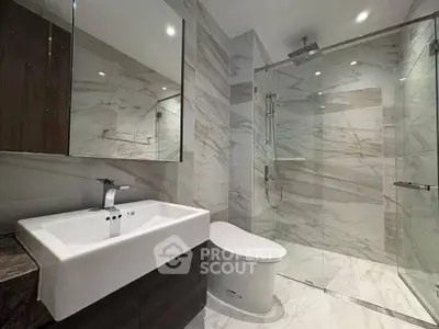 Luxurious modern bathroom with marble tiles and sleek fixtures