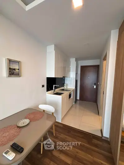 Modern kitchen with sleek design and dining area in a stylish apartment