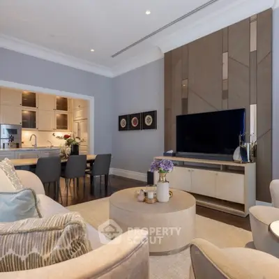 Elegant living room with modern decor and open kitchen layout, perfect for stylish urban living.