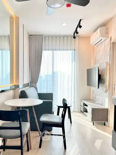 Modern living room with sleek furniture and large window view