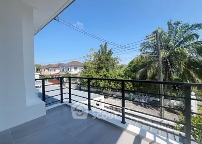 Spacious balcony with scenic view of suburban neighborhood and lush greenery.