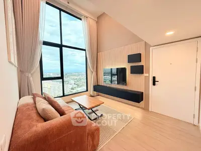 Modern living room with large window and city view, featuring stylish furniture and sleek design.