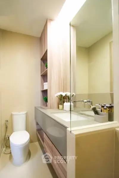 Modern bathroom with sleek design and elegant fixtures in a stylish apartment.
