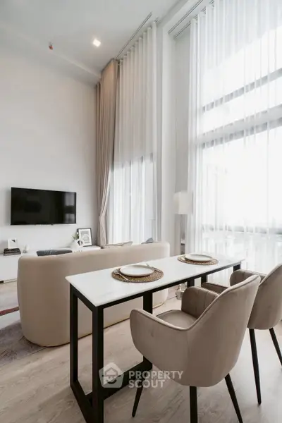 Modern living room with high ceilings and elegant decor