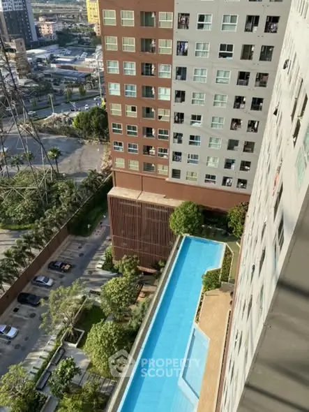 High-rise building with rooftop pool offering stunning city views.