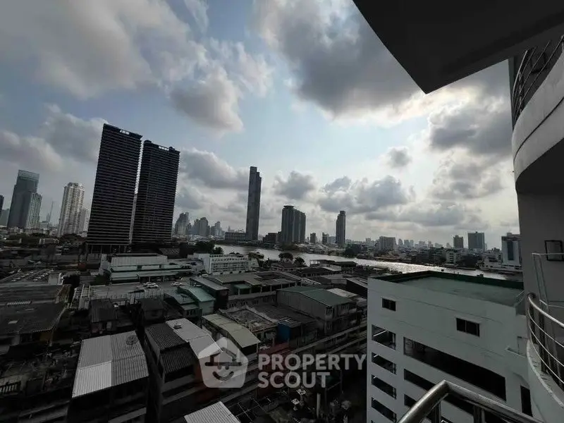 Stunning cityscape view from high-rise balcony with skyline and river