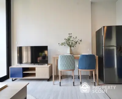 Modern living room with stylish furniture and sleek refrigerator