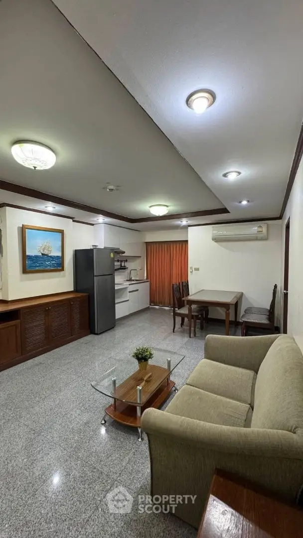 Spacious living room with modern furniture and open kitchen layout