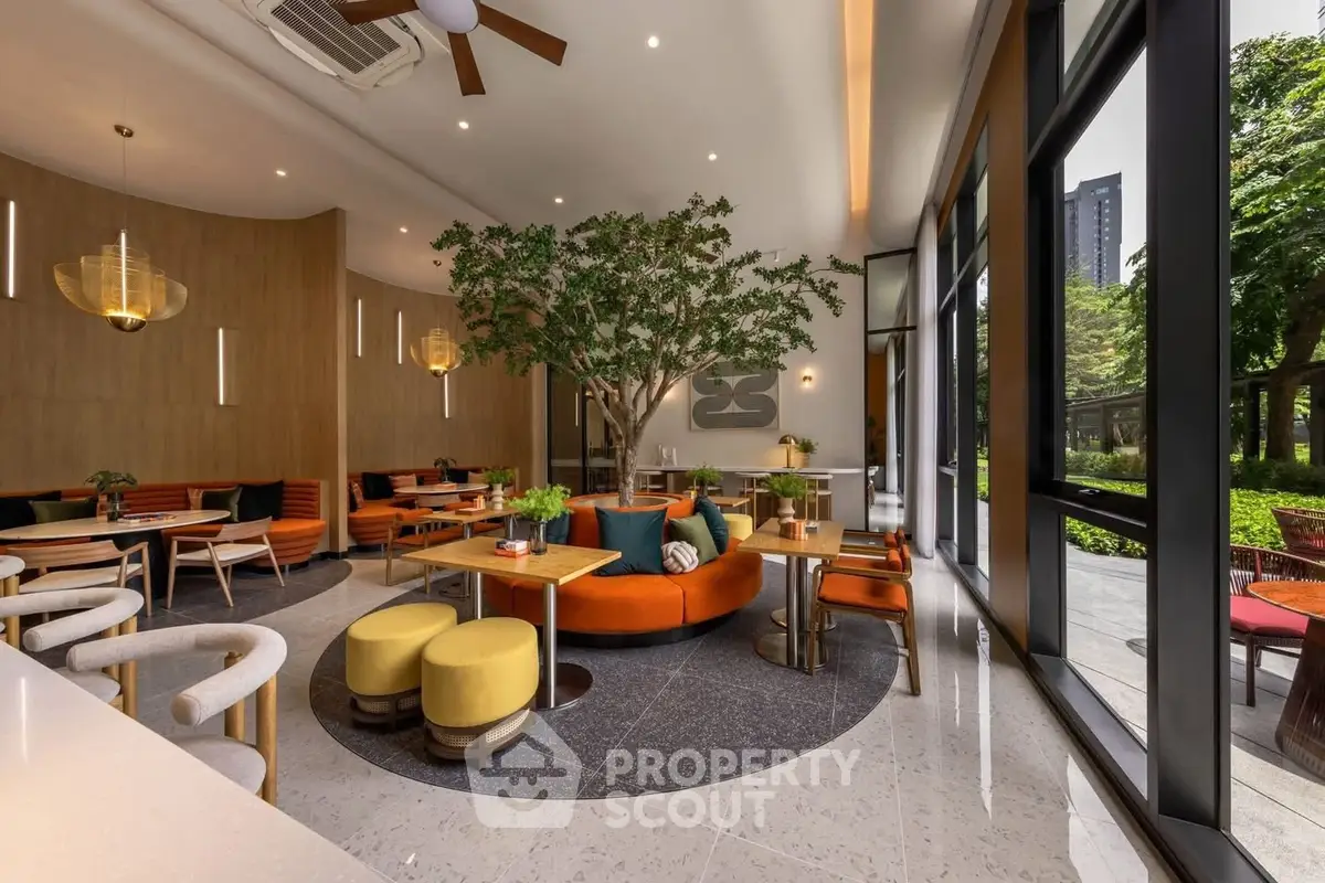 Luxurious modern living room with stylish furniture and lush garden view, perfect for relaxation and entertaining.
