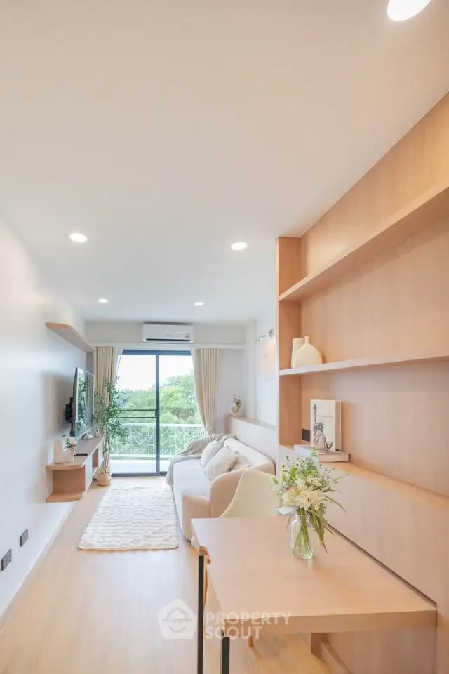 Bright and airy living room with modern decor and balcony view