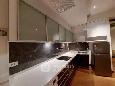Modern kitchen with sleek cabinetry and stainless steel appliances