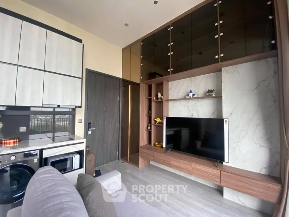Modern living room with sleek cabinetry and built-in entertainment center