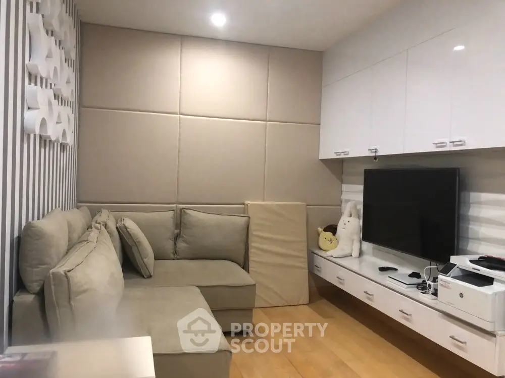 Modern living room with cozy sectional sofa and sleek entertainment unit