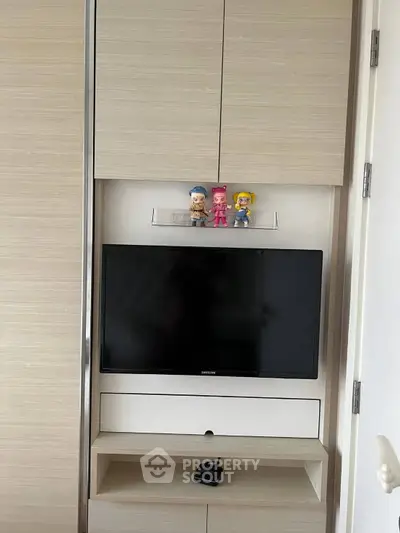 Modern living room with built-in TV and stylish storage solutions
