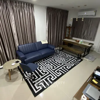 Modern living room with stylish furniture and elegant curtains