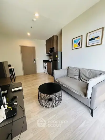 Modern living room with stylish furniture and open kitchen layout
