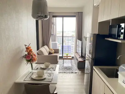 Modern open-plan kitchen and living room with city view
