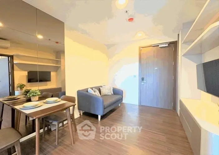 Modern living room with sleek furniture and stylish decor in a cozy apartment.