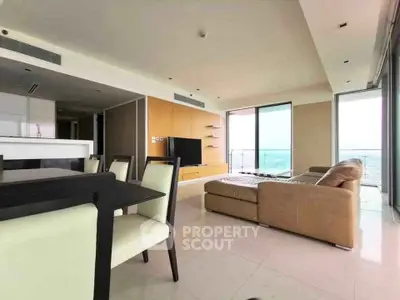 Spacious modern living room with panoramic views and elegant furnishings