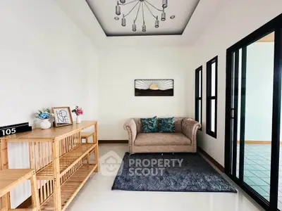 Stylish living room with elegant sofa and modern decor in a bright, airy space.